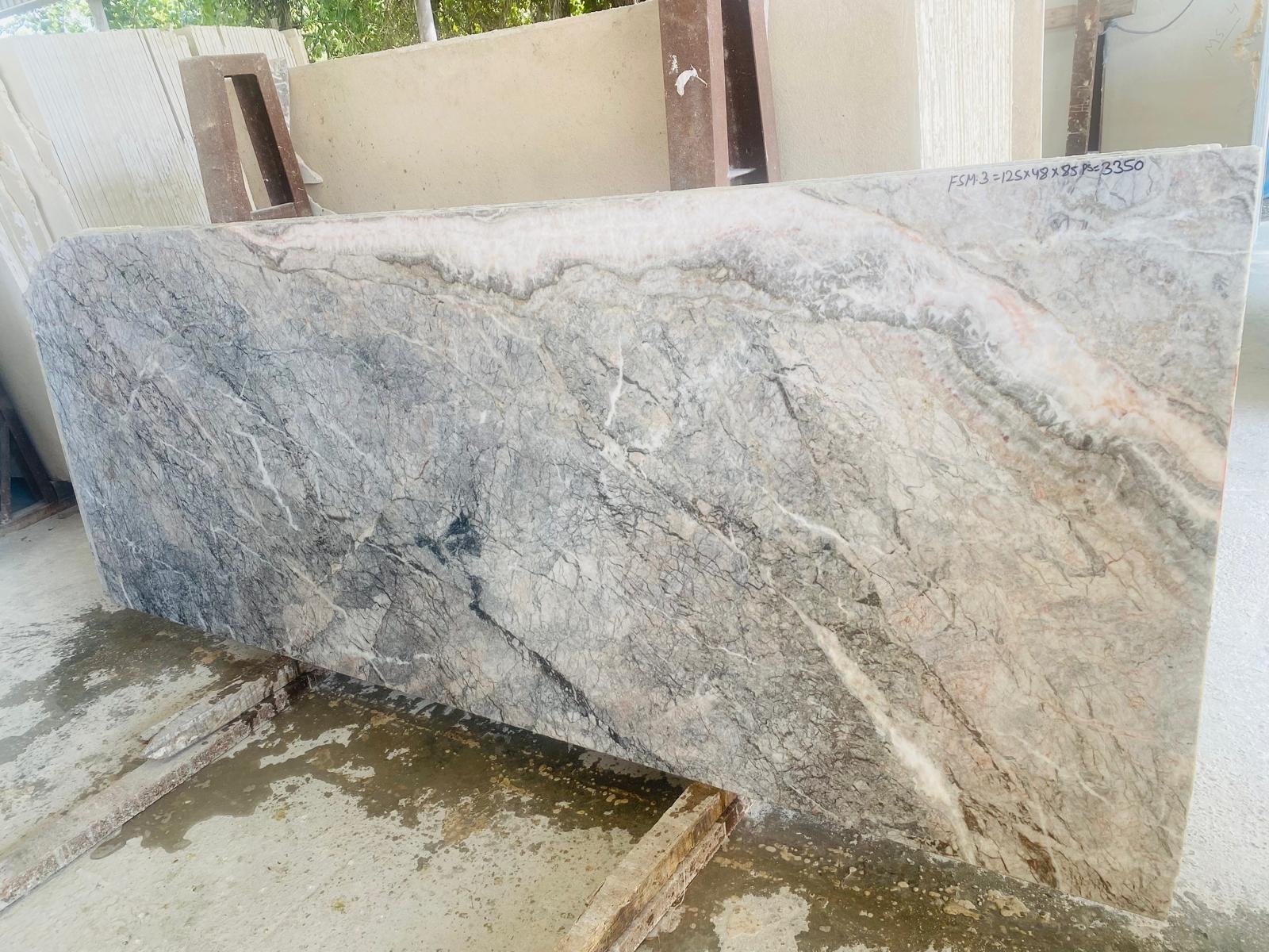Fiori di Pesco Italian marble slab with grey, cream and peach-toned natural movement